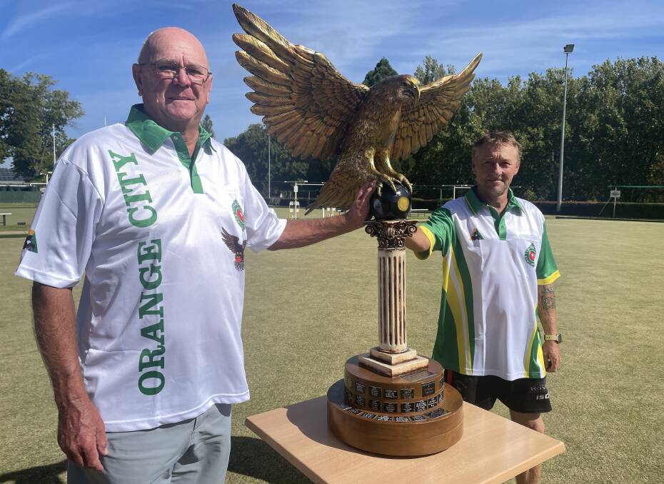 Golden Eagle tournament director Ray Wilson and men's president Adam Simmo with the famous trophy. Picture by Dominic Unwin