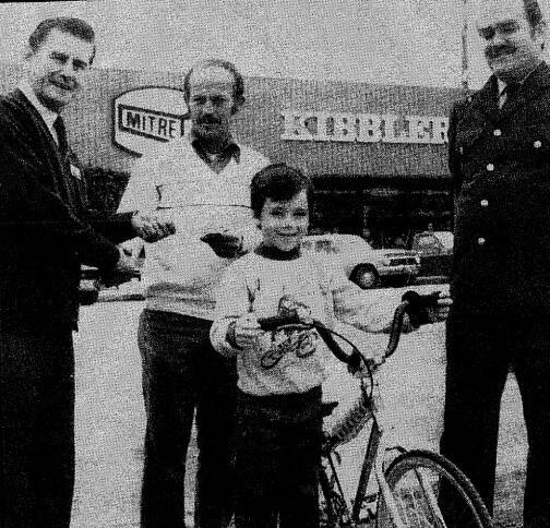 Larry Austin with his father Malcolm, Burnie Kibbler (left) and Constable Errol Kelly of the Cowra PCYC. Photo Cowra Guardain 1984 