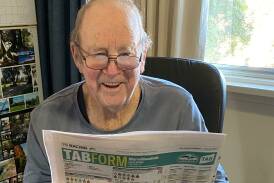 Peter Dawson catching up on the form before a Saturday race meeting. A race been named in honour of Peter at Saturday's Cowra Jockey Club meeting.