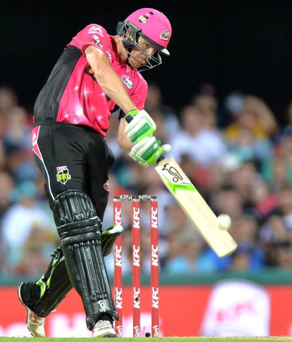 Daniel Hughes drives fluently during his match winning innings of 85 for the Sydney Sixers against Brisbane Heat at the Gabba on Tuesday night. Photo by Getty Images.