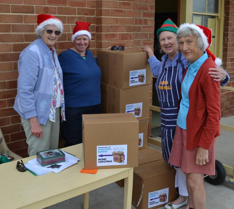Margaret Pengilly, Jane Doolan, Kim Withers and Kathrine Capps who picked up a Christmas hamper.